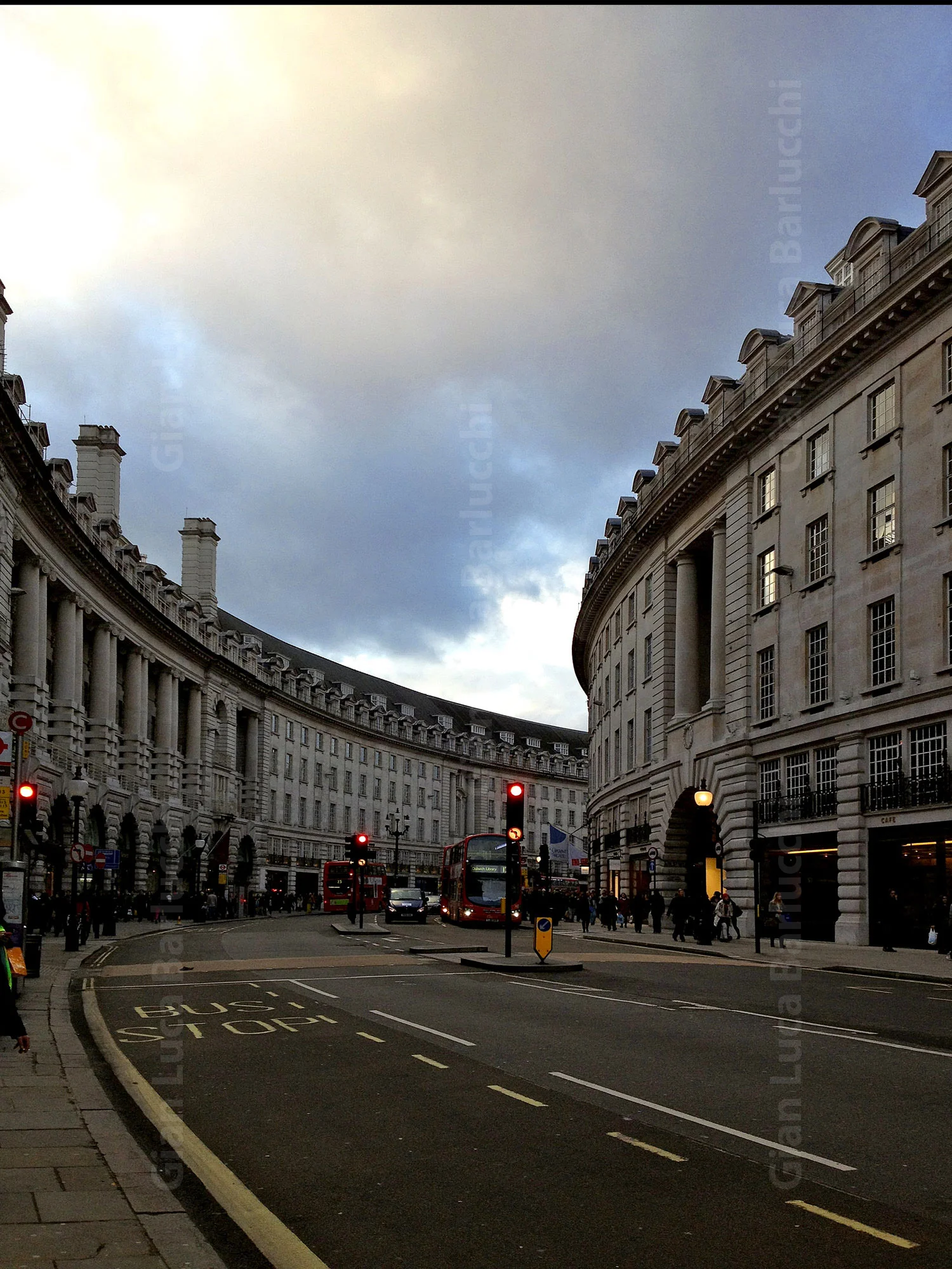 Curved rows of stone buildings lining a London street