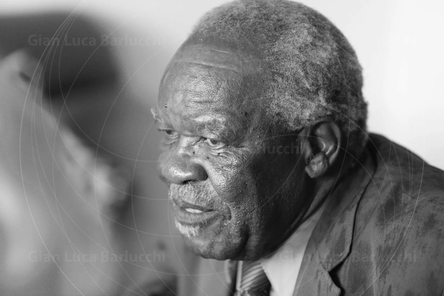 Black-and-white profile of an older man looking to the side
