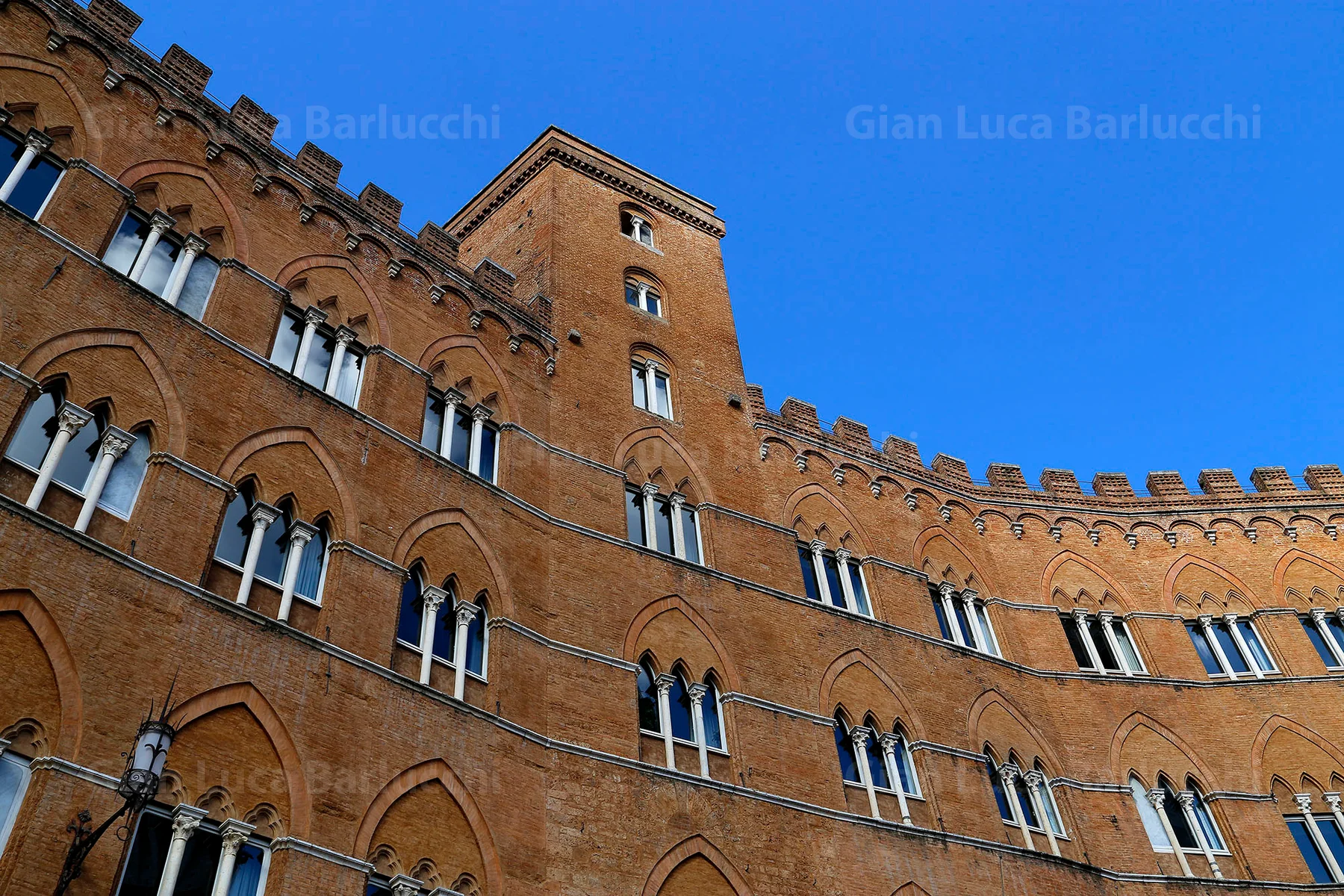 Brick facade of the Palazzo Pubblico on Piazza del Campo in Siena